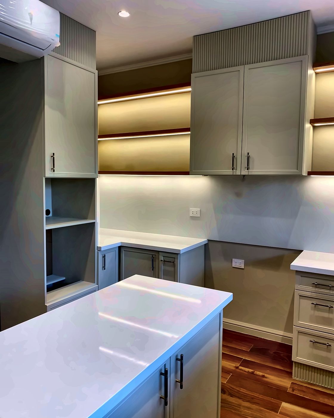 Kitchen corner with tall unit and white quartz island, New Giza
